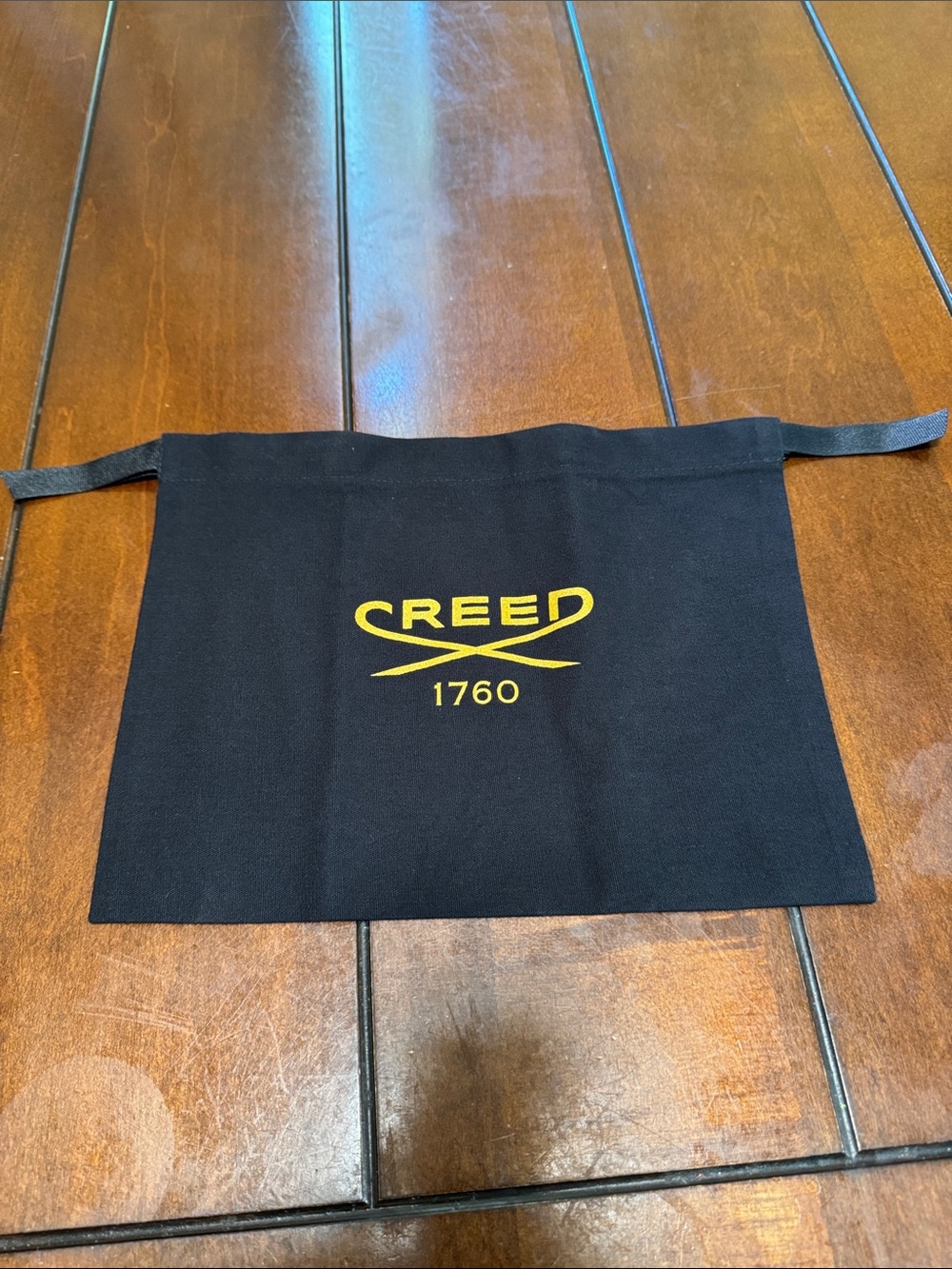 Creed Black Dust Pouch with Yellow Logo